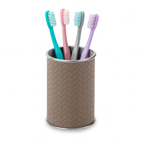Leather-wrapped stainless steel brush holder on a white ground