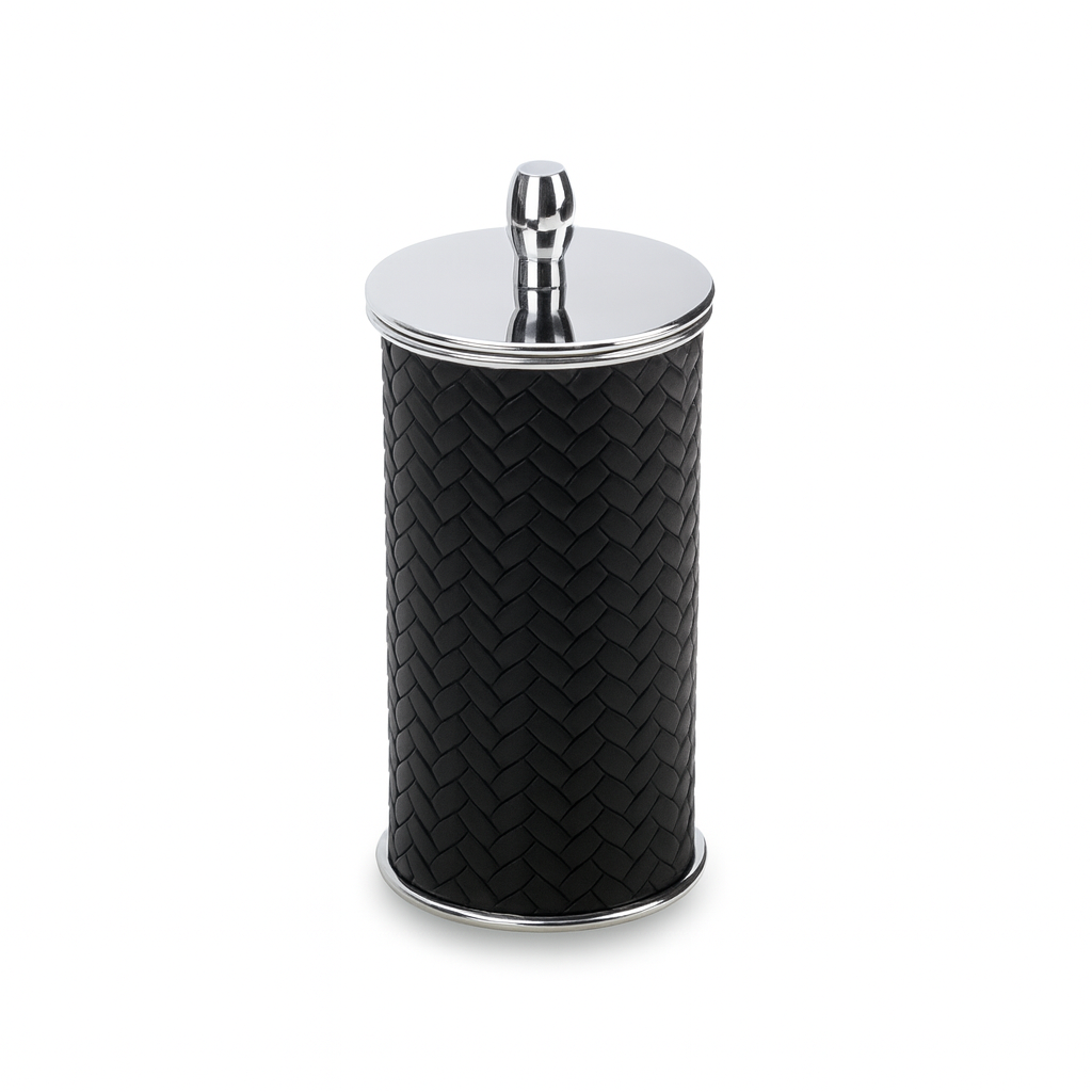 Lidded leather and steel cotton pad holder at an angle
