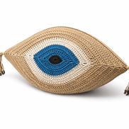 Beige crochet eye cushion from above, blue iris ringed in white