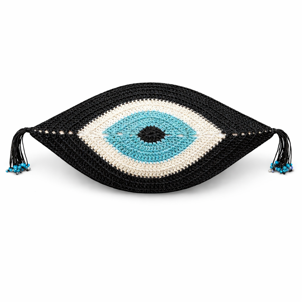 Black evil eye crochet cushion with turquoise iris, 35 x 55 cm