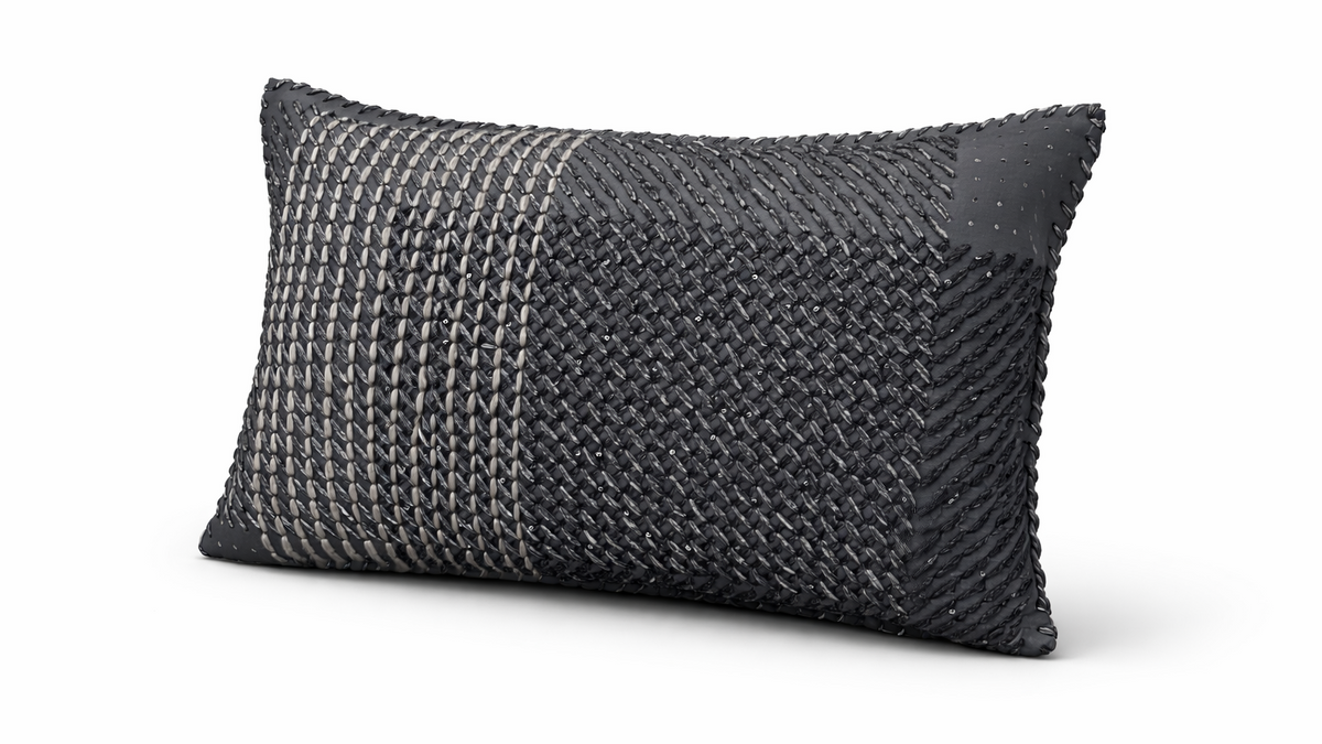 The anthracite hand-laced cushion showing its woven yarn texture
