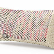 Close view of cashmere yarn drawn through the ecru leather front