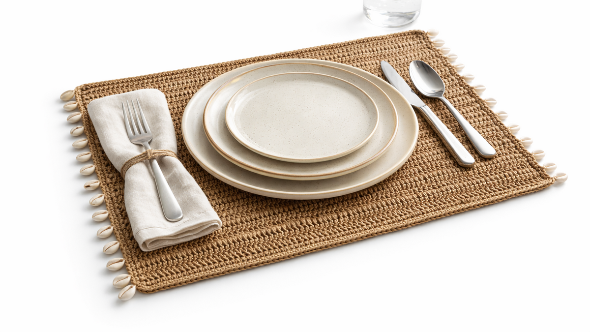 The jute shell placemat at an angle, dense hand-crocheted weave