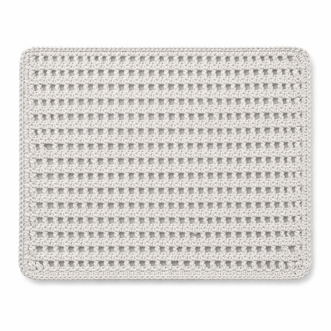White leather cord placemat in an open crocheted lattice, 40 x 30 cm
