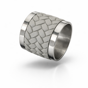 Woven leather and stainless steel napkin ring seen at an angle
