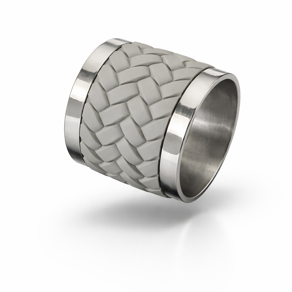Woven leather and stainless steel napkin ring seen at an angle