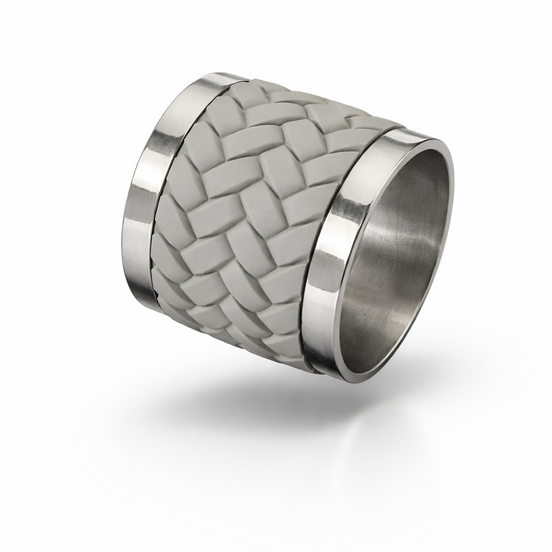 Woven leather and stainless steel napkin ring seen at an angle