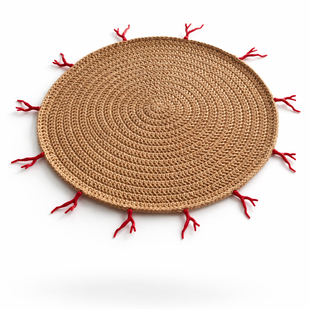 The natural jute red coral placemat at an angle
