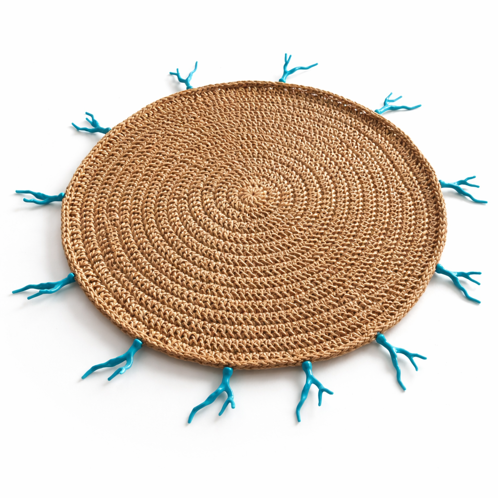 The natural jute placemat at an angle, turquoise corals along the rim