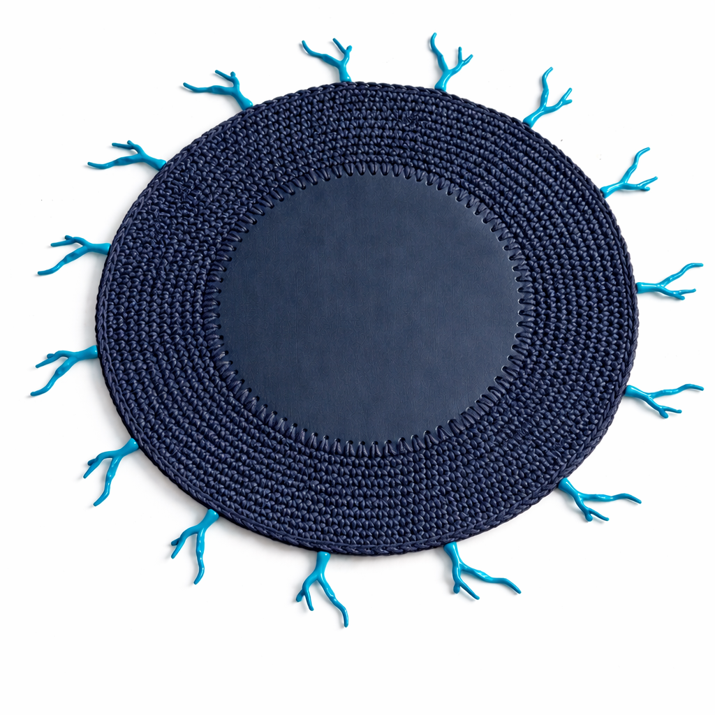 Navy crocheted placemat edged with turquoise coral forms, 36 cm