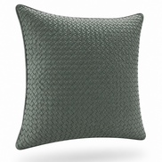 The woven leather cushion at an angle, piped seam along the edge