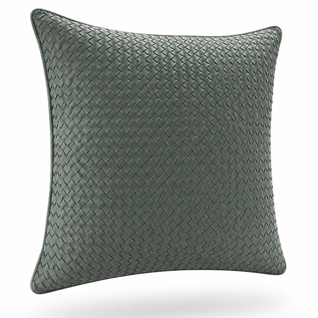 The woven leather cushion at an angle, piped seam along the edge